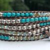 wrap, wraps around wrist, zinc, blue, mottled blue, semiprecious stones, turquoise, hammered button, adjustable, handcrafted, takes 2-4 hours to make, waxed cord, designer inspired