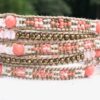 wrap, wraps around wrist, coral, gold, hammered button, adjustable, handcrafted, takes 2-4 hours to make, semiprecious stone, waxed cord, designer inspired, spring, summer