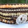 wrap, wraps around wrist, brown, zinc, hammered button. agate, adjustable, handcrafted, takes 2-4 hours to make. semiprecious stones