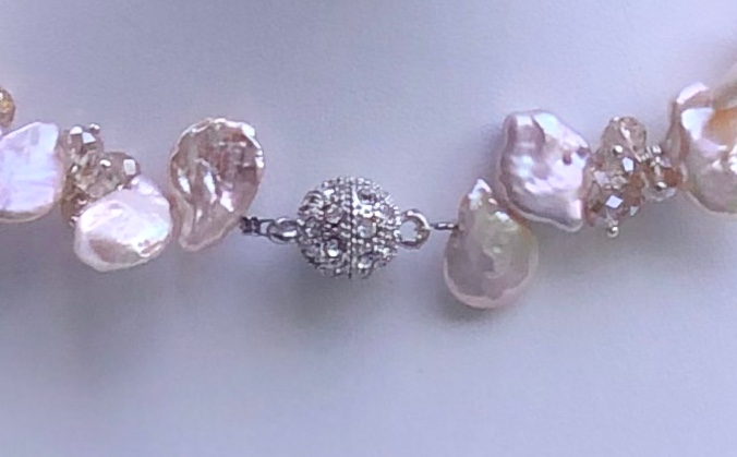 unique shape, freshwater pearl, grown in specific area of China, crystals formed into floral pattern, pink, magnetic clasp