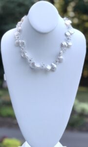 unique shape, freshwater pearl, grown in specific area of China, crystals formed into floral pattern, white, magnetic clasp